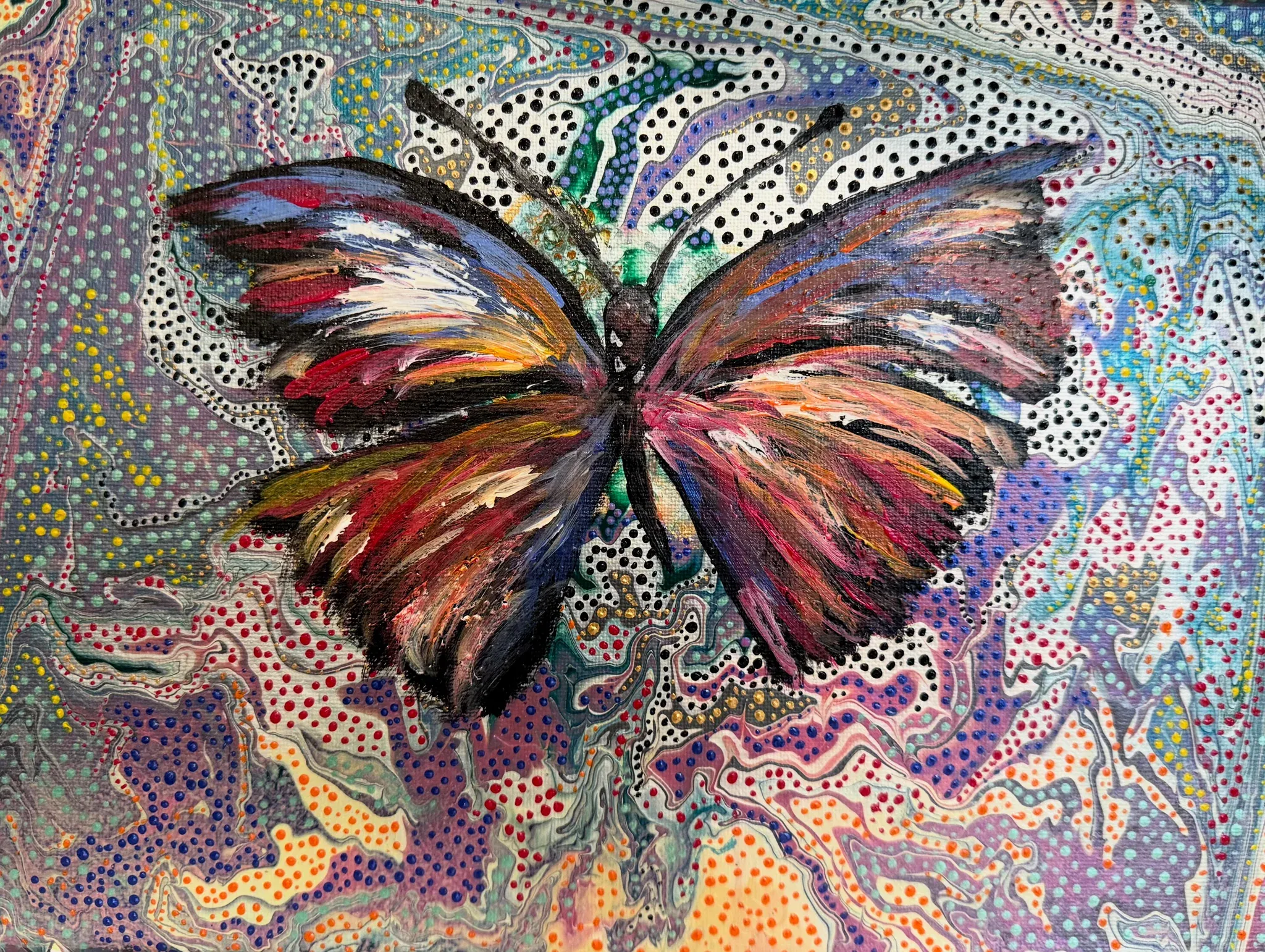 A butterfly with its wings spread wide, painted in feathery strokes of crimson, ochre, cream, slate blue and black. Around it the whole surface is a marbled pour of lilac, teal, coral and cream, overlaid with thousands of small dots in red, yellow, blue and black. Jewel-like, busy, celebratory.